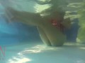 Elegant and flexible babe, swimming underwater in the outdoor swimming pool. 3 1