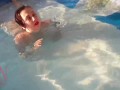 Elegant and flexible babe, swimming underwater in the outdoor swimming pool. 2 2
