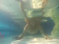 Elegant and flexible babe, swimming underwater in the outdoor swimming pool. 3 2