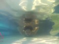 Elegant and flexible babe, swimming underwater in the outdoor swimming pool. 3 2
