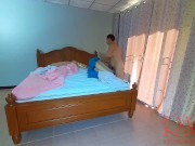 Nudist housekeeper Regina Noir makes the bedding in the bedroom. Naked maid. Naked housewife. c2