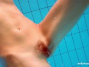 Marusia shows you her hairy sweet vagina in the pool