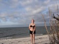 Showing off my naked body on the beach