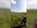 Busty redhead mature shows off her big boobs while out on a hike