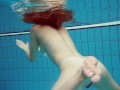 Diana's redhead beauty enhances her swimming grace