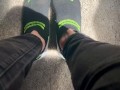 Two socked feet rub against one another - SFW