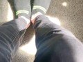 Two socked feet rub against one another - SFW