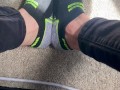 Two socked feet rub against one another - SFW