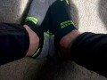 Two socked feet rub against one another - SFW