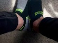Two socked feet rub against one another - SFW