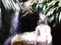 beautiful european girl swims naked in the river