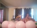 Milf with extreme long hair popping balloons and smoking cigarettes while filming up her own skirt