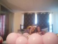 Milf with extreme long hair popping balloons and smoking cigarettes while filming up her own skirt