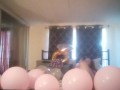 Milf with extreme long hair popping balloons and smoking cigarettes while filming up her own skirt