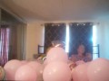 Milf with extreme long hair popping balloons and smoking cigarettes while filming up her own skirt