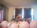 Milf with extreme long hair popping balloons and smoking cigarettes while filming up her own skirt
