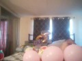 Milf with extreme long hair popping balloons and smoking cigarettes while filming up her own skirt
