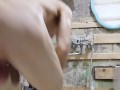 slender student washes in a dirty shower