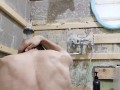 slender student washes in a dirty shower