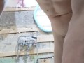 slender student washes in a dirty shower