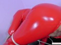 Exposed pussy gets oiled wearing a crotchless red PVC outfit