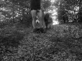 Naked submissive slut taken for a walk on a leash in forest