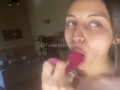 She enjoys sensually sucking her Dildo