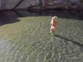 Naked blonde girl explores waterfall- relaxing and beautiful