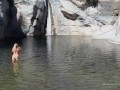 Naked blonde girl explores waterfall- relaxing and beautiful