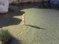 Naked blonde girl explores waterfall- relaxing and beautiful