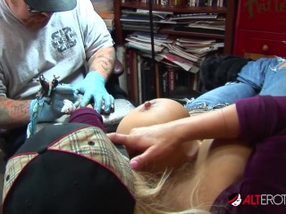 Shyla Stylez gets tattooed while playing with her tits