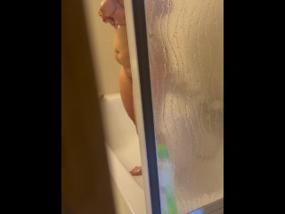 Exhibitionist wife's shower before New Year's Eve. Hot milf caught playing with her dildo.