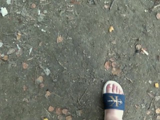 I walk in slippers in the forest. POV.