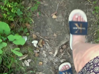 I walk in slippers in the forest. POV.