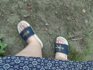 I walk in slippers in the forest. POV.