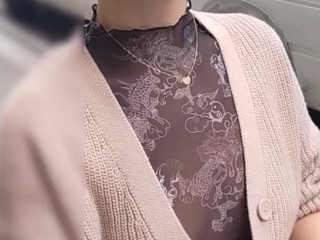 see-through blouse, visible breasts and nipples in the city center