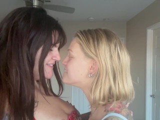 Sexy lesbians French kiss with tongue close up