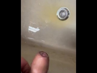 Soft Asian penis peeing in sink