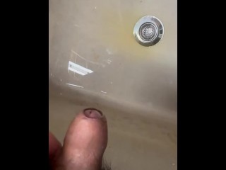 Soft Asian penis peeing in sink