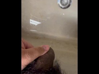 Soft Asian penis peeing in sink