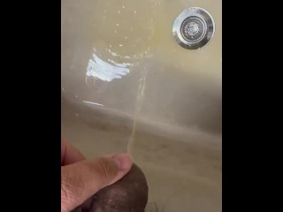 Soft Asian penis peeing in sink