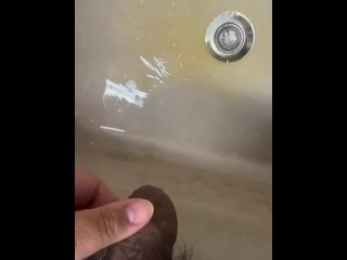 Soft Asian penis peeing in sink