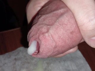 An excited big cock in close-up really wants to cum. Milky thick cum