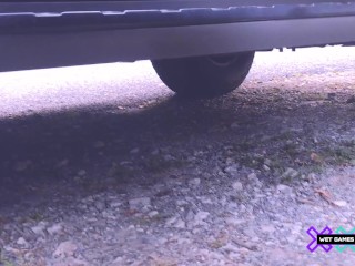 Pissing outdoors outside the car