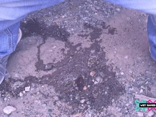 Pissing outdoors outside the car