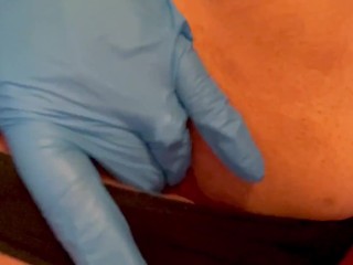 Self pleasure with nitrile gloves in panties until they are totally soaked through