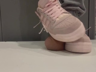 trampling in pink sneakers