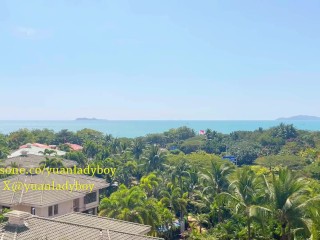 Chinese ladyboy cums on balcony of sea view hotel