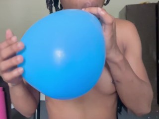 Blowing up balloons while naked