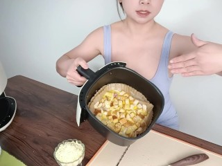 Sexy busty beauty shows off her cooking skills, making toast and cheese pancakes